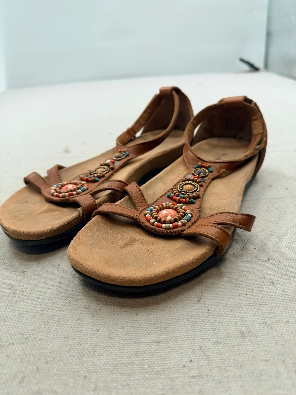 Minnetonka Women's Tan Beaded T-Strap Sandals